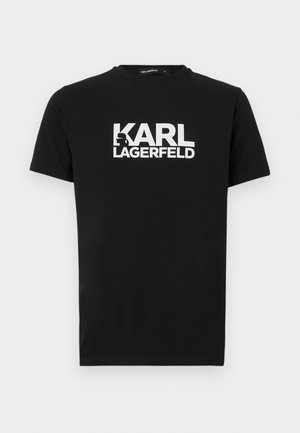 T-shirt preta de algodão com mangas curtas, estampada com um logótipo branco "KARL LAGERFELD" e um detalhe em silhueta. Design com gola redonda.