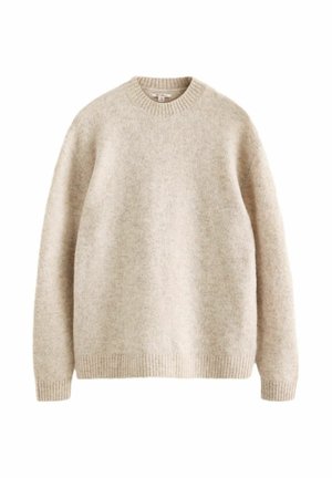 Light beige wool sweater with a crew neckline, ribbed cuffs and hem, soft texture, and a relaxed fit. No visible patterns or accents.