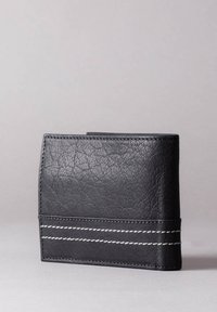 Black leather wallet with a textured surface, featuring white stitching accents around the base and a sleek, rectangular design.
