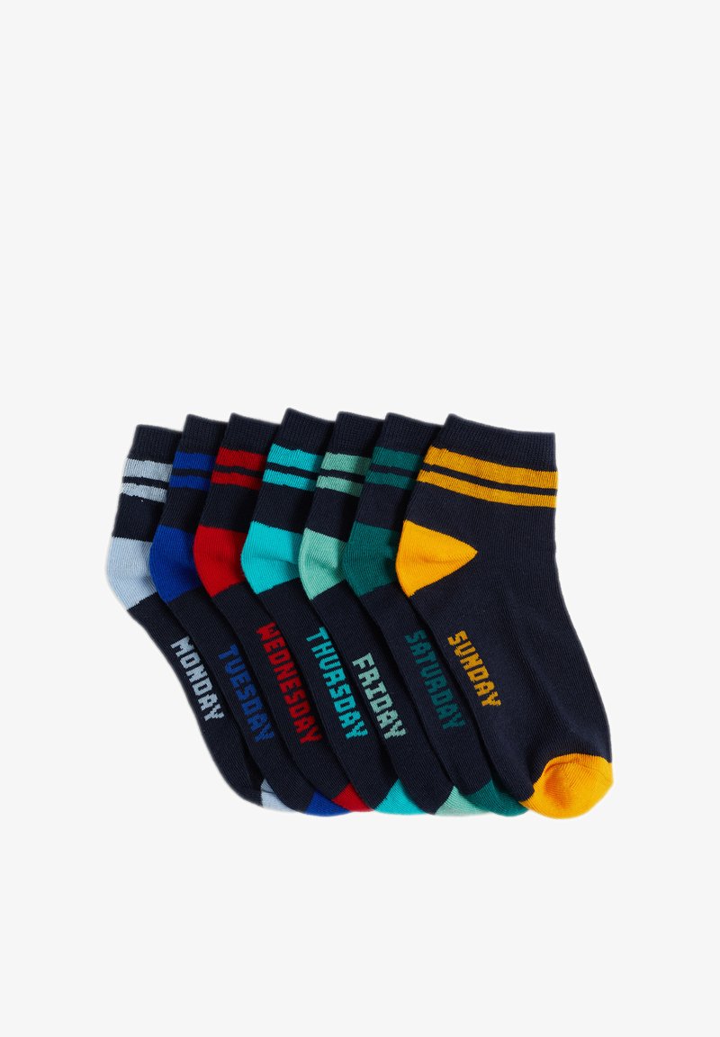 Septi pāri apkalpes zeķu dažādās krāsās ar dienu etiķetēm. Materiāls ir mīksts adījums, ar kontrastējošām svītrām un ribotām piedurknēm.