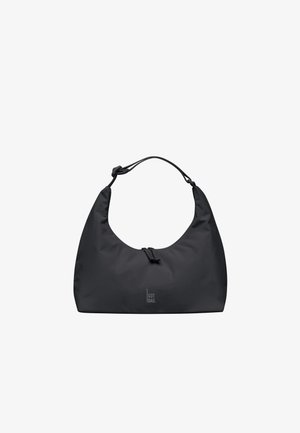 Sac à épaule noir en forme de croissant avec bandoulière réglable et fermeture éclair à l'avant, arborant un petit logo "GOT BAG." en bas au centre.