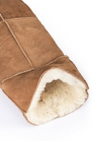 Brown suede mitt with a soft, cream-colored fur lining. Features visible stitching and a rounded opening for hand insertion.