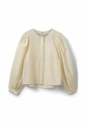 Creme bluse med et struktureret design, rund halsudskæring og puffede lange ærmer. Har broderede blomstermotiver og knaplukning.