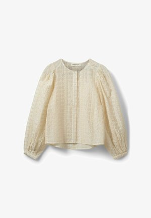 Cream blouse with a textured design, round neckline, and puffed long sleeves. Features embroidered floral patterns and a button closure.