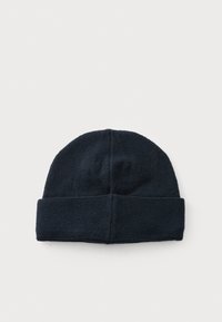 Béret tricoté bleu marine avec un revers. Fabriqué en tissu doux et texturé, présentant un design simple sans embellissements supplémentaires.