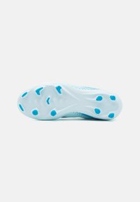 Light blue athletic shoe outsole featuring a textured design with multiple studs for traction; smooth edges and contoured shape.