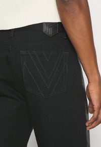 MCM COLLECTION PANTS - Vaqueros rectos - black