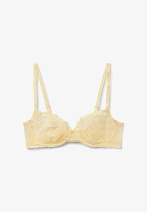 Soutien-gorge à armatures en dentelle jaune clair avec bretelles festonnées réglables et broderie florale, présenté à plat sur fond blanc.