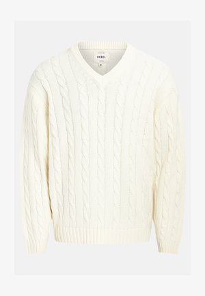 Pulover crem tricotat cu un design în formă de V, cu manșete și margine cu nervuri. Fabricat dintr-un material moale, având un model texturat în zigzag.