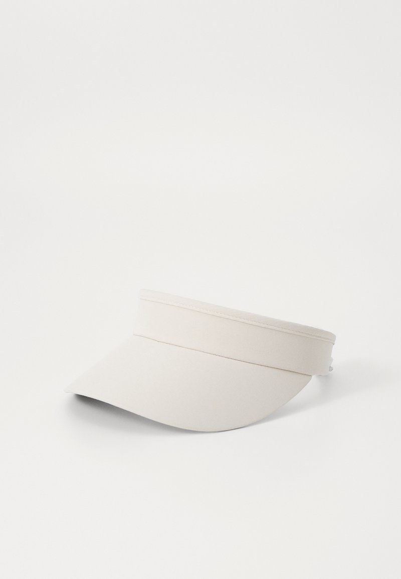 Beige visor made of fabric with a wide brim, featuring a double band across the front for added support and a curved shape.