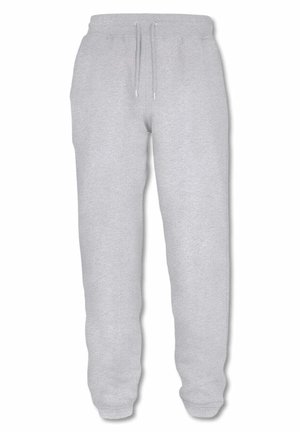 Pantalones de chándal grises fabricados con material suave, con una cinturilla elástica con cordón, puños ajustados y bolsillos laterales.