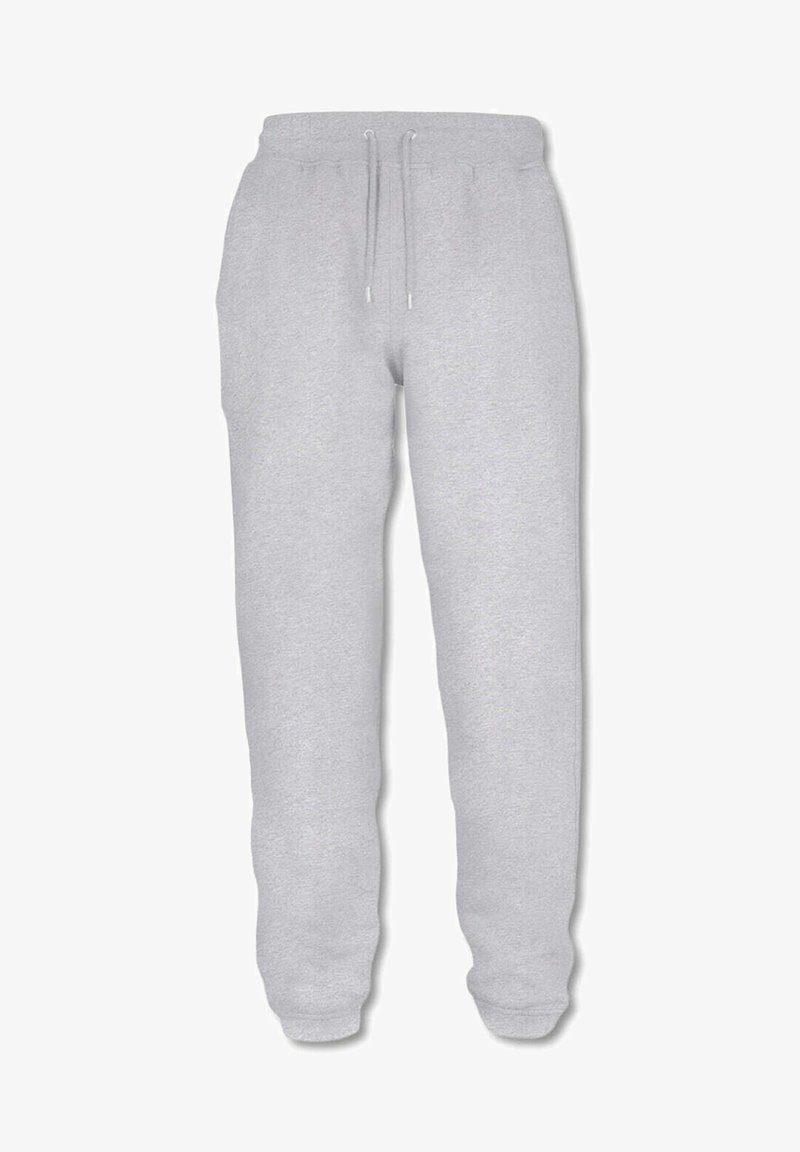 Grijze sweatpants gemaakt van zacht materiaal, met een elastische tailleband met trekkoord, smal toelopende boorden en zijzakken.