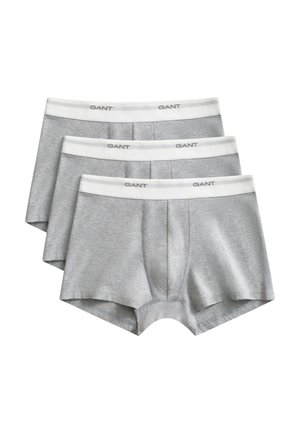 Szürke boxeralsó fehér elasztikus derékpánttal, amelyen a "GANT" logó látható. A szövet sima és rugalmas, testhez simuló kialakítású.