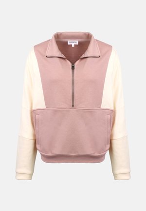 Lettet, lynlåset pullover i pink og creme, med høj krave, frontlomme og afslappet pasform. Blød tekstur med farveblokering design.