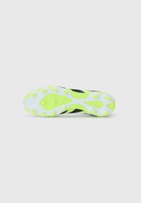 Black athletic shoe sole with a dynamic design, featuring a vibrant neon green accent and rounded grip studs for traction.