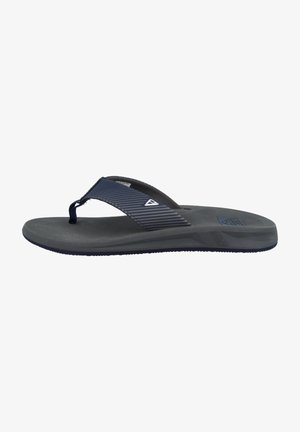 Navy blue flip-flop with a textured dark gray sole, featuring a sleek strap with horizontal ridges and an accent logo near the toe post.