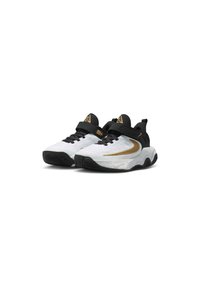Zapatillas deportivas en blanco y negro con acentos dorados, que presentan un upper texturizado, una correa sobre los cordones y una suela con múltiples patrones.