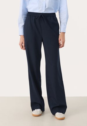 Navy wide-leg trousers with an elastic waistband and drawstring. Made from soft fabric, featuring a relaxed fit and no visible patterns.