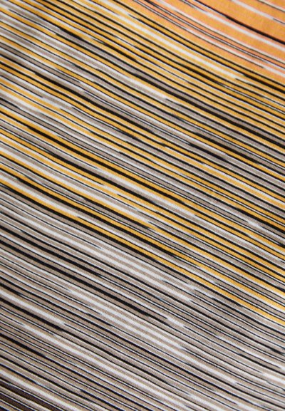 Striped fabric featuring horizontal lines in yellow, black, and white, with varying widths and a smooth, textured surface.