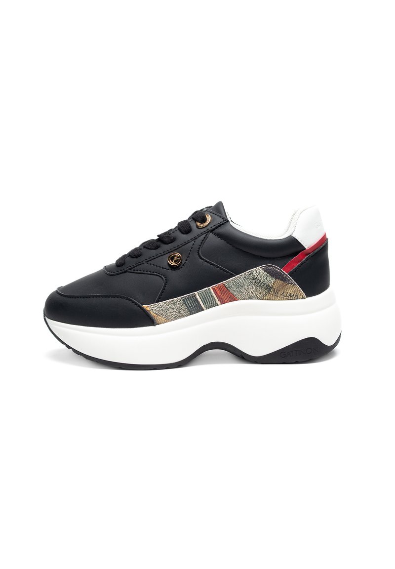Black synthetic sneaker with a textured fabric panel featuring beige, green, and red stripes. Thick white sole and black accent details.