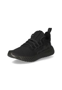 Black athletic shoe with a mesh upper, elastic lace design, and textured rubber sole. Features a pull tab on the heel and subtle branding.