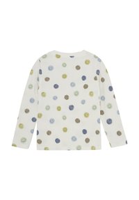 Långärmad skjorta i mjukt vitt tyg med ett mönster av färgglada, texturerade leende prickar i gröna, blå och bruna nyanser.