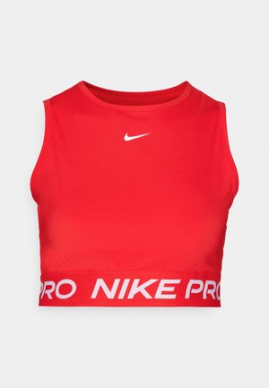 Top sportiv Nike Pro roșu, realizat dintr-un material neted și elastic. Prezintă un logo alb pe piept și un elastic lat cu marcă în partea inferioară.