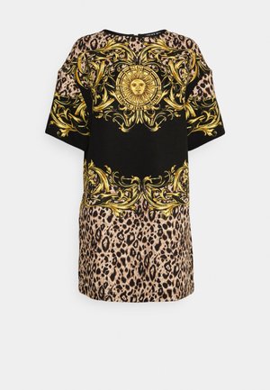 Tunique noire et imprimé léopard avec détails graphiques dorés et motif soleil. Manches larges et coupe ample avec une texture lisse.