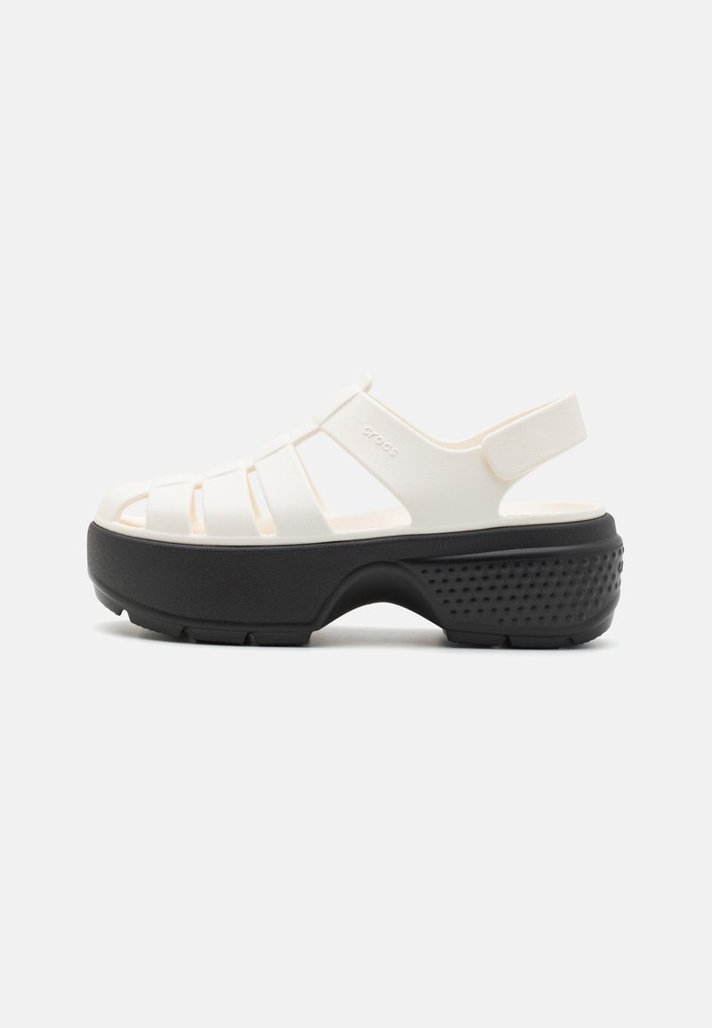 White plastic sandal with cut-out straps and a black platform sole. Features a back strap for support and textured side accents.