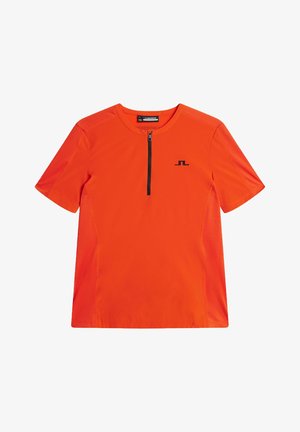 T-shirt de sport orange à manches courtes, avec une fermeture éclair noire au niveau du col et des panneaux latéraux en mesh pour une meilleure respirabilité. Logo noir sur la poitrine.