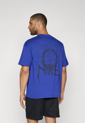 Blue cotton t-shirt with a large black graphic design featuring a basketball and hoop on the back. Short sleeves, relaxed fit.