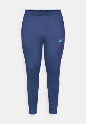 Marineblauwe sportbroek van stretchstof, met een elastische tailleband en een lichtblauw Nike-logo op de linker dij.