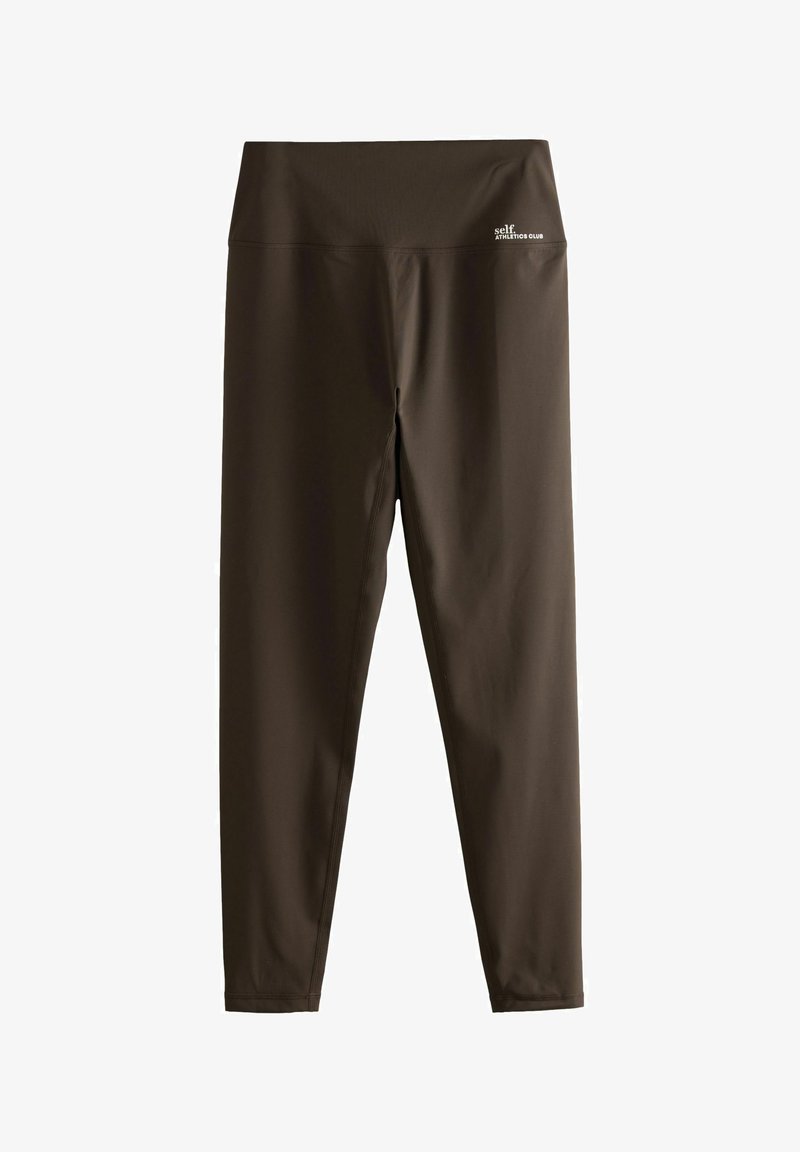 Leggings de sport marron avec uneLarge ceinture. Fabriqués en tissu extensible, ils présentent une texture douce et un petit logo sur la ceinture.