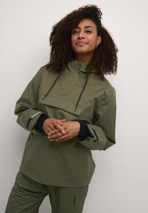Olive green waterproof jacket with a half-zip, a front pocket, and black detailing on sleeves. Features a hood and adjustable drawstrings.