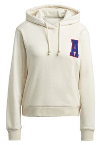 Krämfärgad hoodie med dragsko i huvan, ribbade sidor och en blå broderad bokstav "A" på bröstet. Mjuk, texturerad tyg.