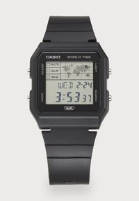 Montre numérique noire avec affichage LCD, affichant une carte du monde, l'heure, le jour et la date. Comprend des boutons pour ajuster les paramètres et la fonction d'éclairage.