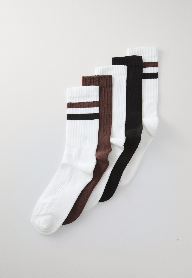 Five pairs of crew socks in white, brown, and black. Thick ribbed texture with horizontal stripes on the white pair.