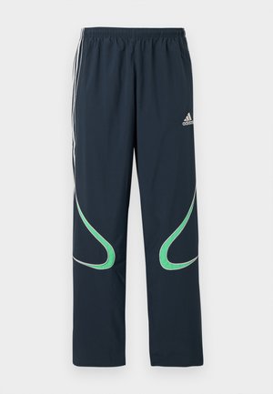 Námořnické tepláky vyrobené z lehkého materiálu, s bílými pruhy po stranách a zelenými zakřivenými akcenty. Elastický pas pro pohodlí.