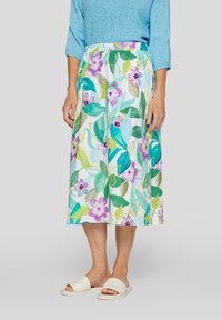 Floral midi skirt in white, featuring blue, green, and purple leaf and flower patterns; elastic waistband and lightweight fabric.