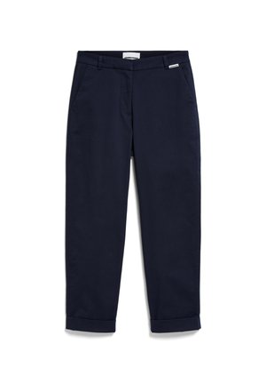 Navyblå byxor gjorda av bomull, med en rak design, uppvikta fållar och sidofickor. Minimalistisk märkesetikett på midjan.