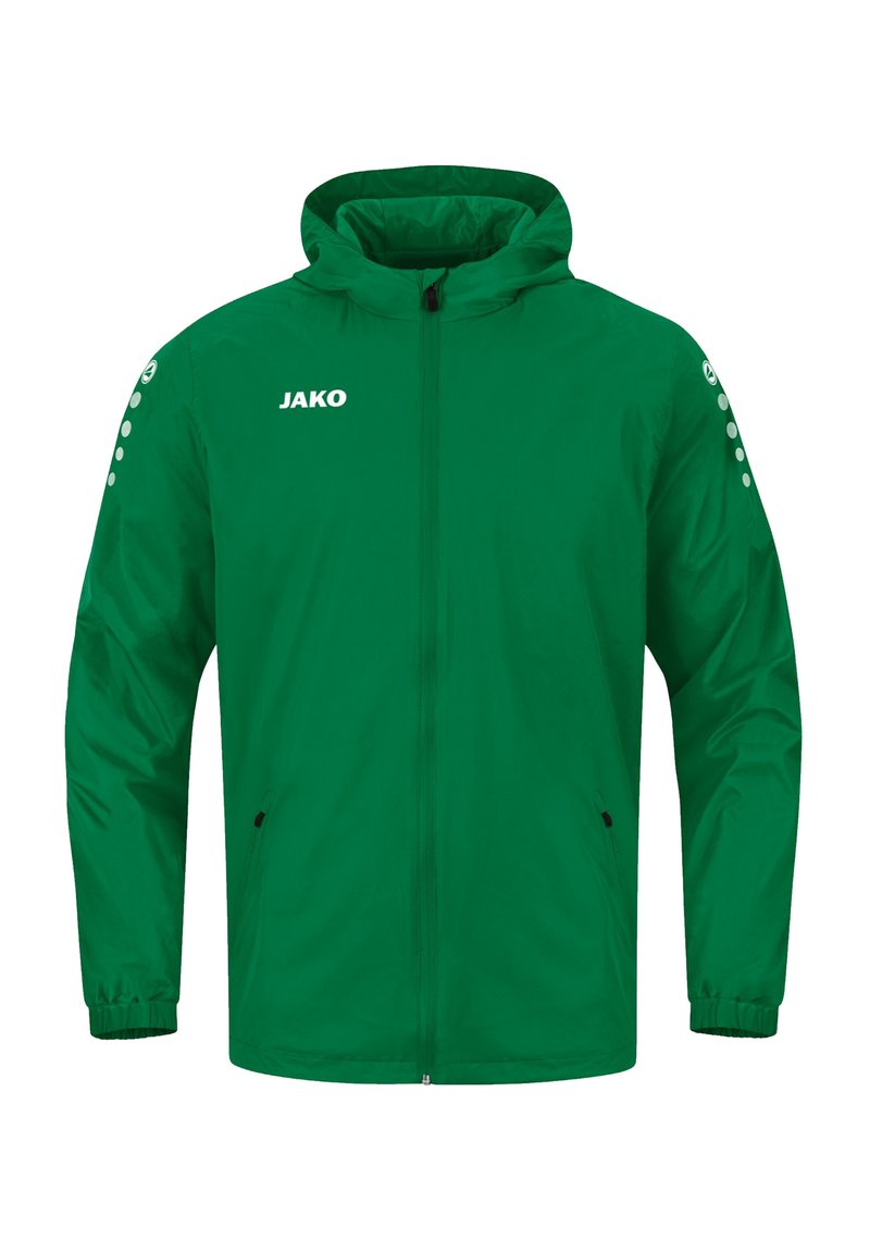 Giacca leggera verde con cappuccio, chiusura a zip frontale, polsini elastici e due tasche laterali. Presenta il logo JAKO e un accento a pois sulla manica.