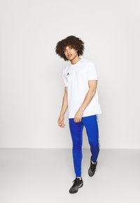 adidas Performance SQ21 SQUADRA AEROREADY SLIM - Calças de fato de treino - team royal blue/team solar yellow