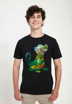 Black cotton t-shirt featuring a colorful graphic of a lion silhouette with jungle scenes, characters, and vibrant colors on the front.