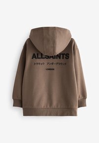 Sweat à capuche marron avec texte noir "ALLSAINTS", caractères japonais et "LONDON" imprimé au dos, présenté à plat sur fond blanc.