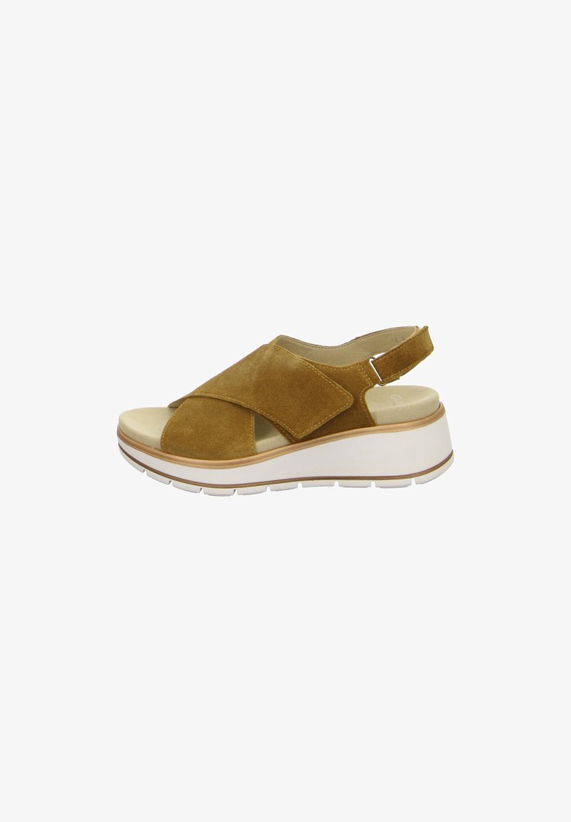Sandale en suède marron avec des brides croisées, bride arrière réglable, semelle intérieure beige rembourrée et épaisse semelle plateforme blanche.