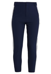 Nattblå byxor med smal passform, med vita sidosträck. Tillverkade av stretchigt tyg med en slät yta och en ren midja.