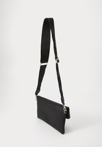 Black crossbody bag made of textured material, featuring an embossed logo pattern, sleek rectangular shape, and adjustable strap.