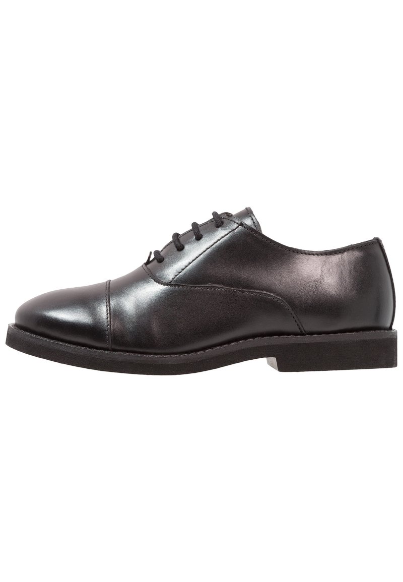 Black polished leather oxford shoe with closed lacing, cap toe, and low stacked heel on white background.