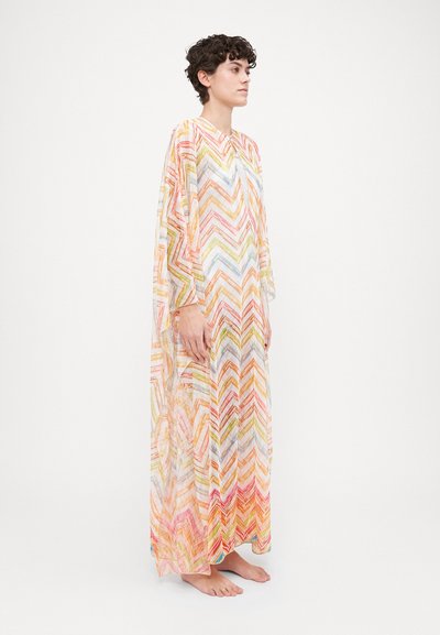 Kaftan transparent cu un model în zigzag în culori pastelate, cu decolteu în V și mâneci largi, care se extind până la glezne.