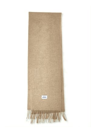 Beige sjaal van zachte stof, met franjes aan de randen en een klein logo-label aan het ene uiteinde. Rechthoekige vorm met een gladde textuur.